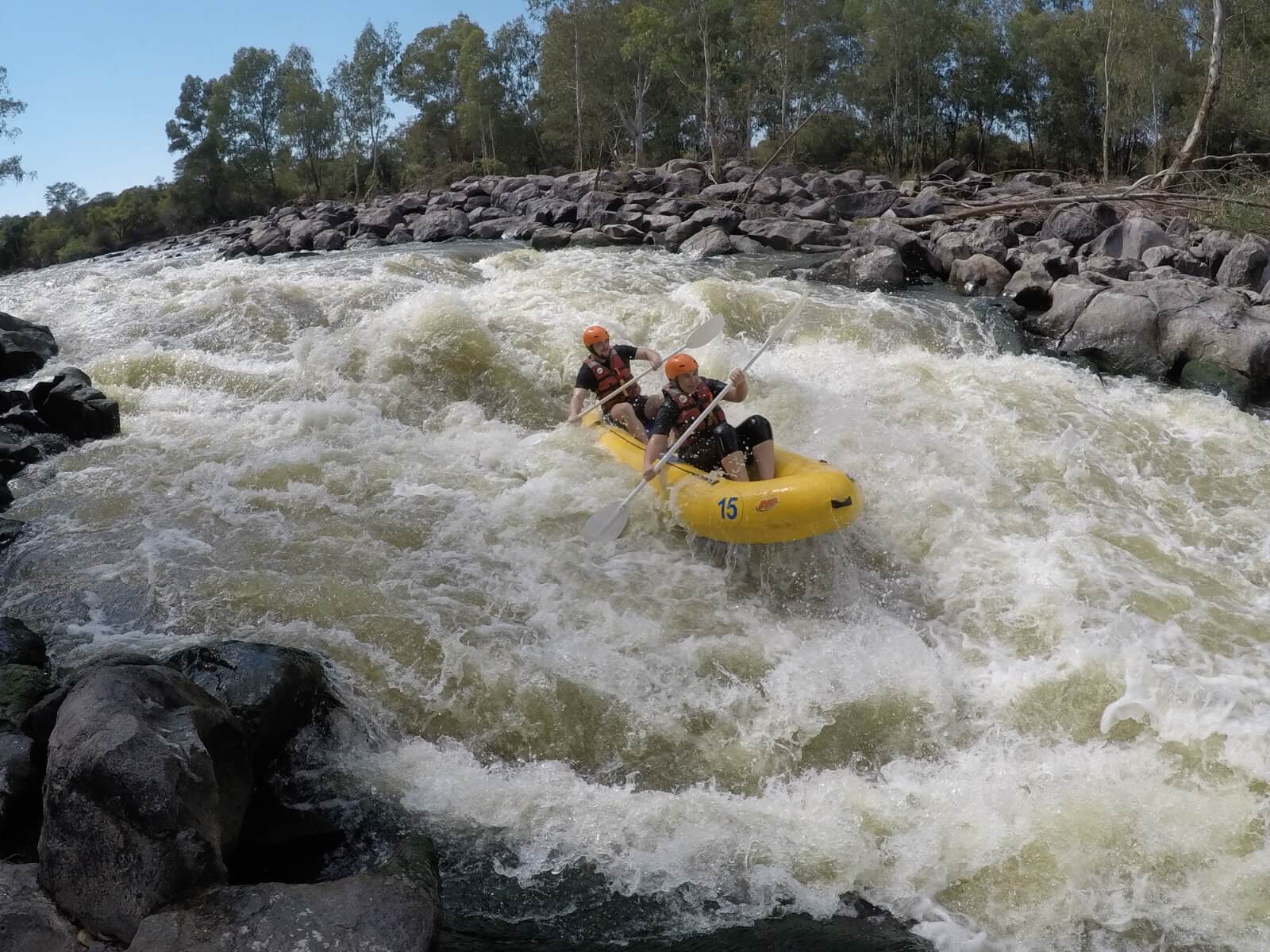 two people white water rafting